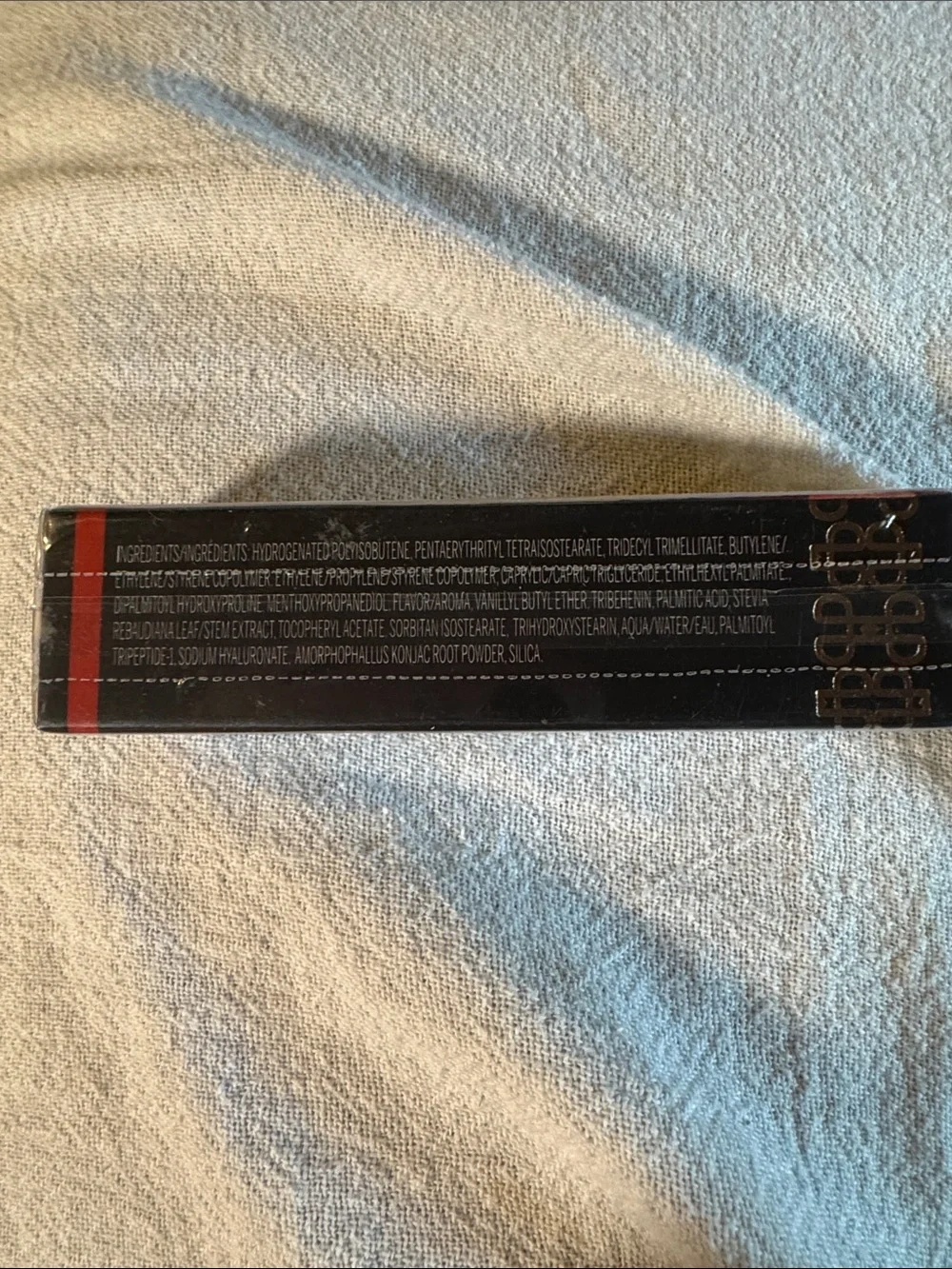 Ignite Lip Plumping Lip Gloss in Cinnamon - Deep Redish/ Gold Shade